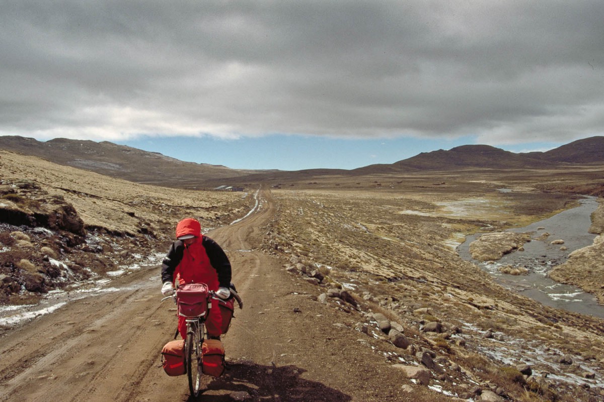 crossing Sani Flats with a storm quickly moving in from Sani Pass in the far distance