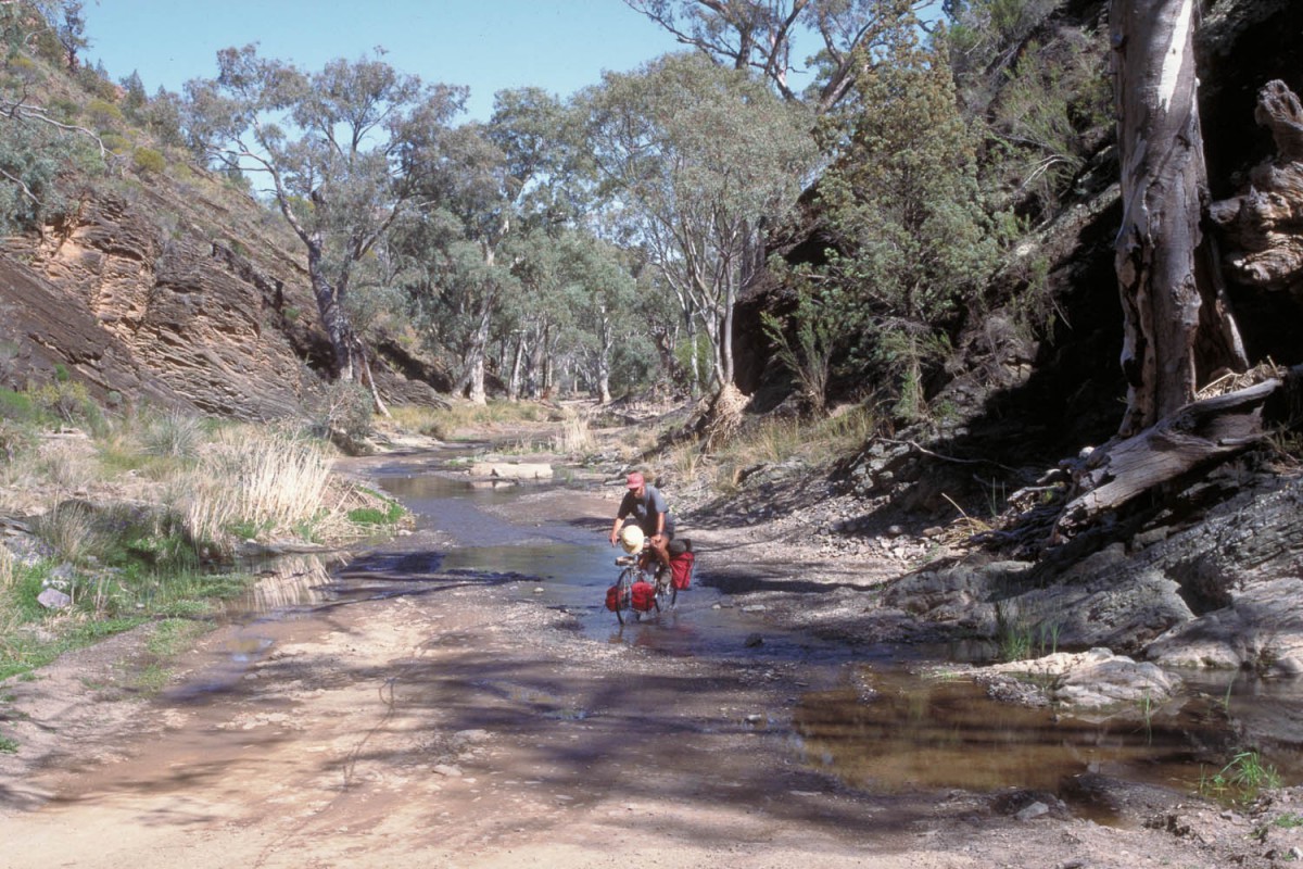 The road follows the river bed