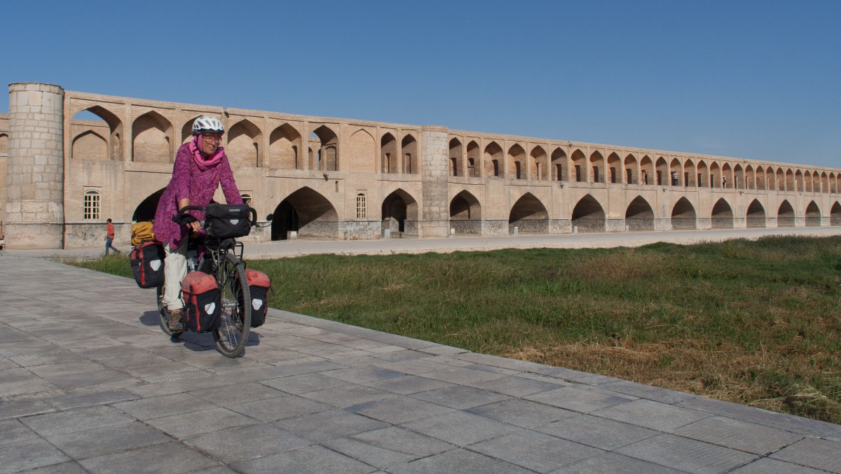 Cross one of the old bridges in Isfahan and continue cycling along the south bank of the river