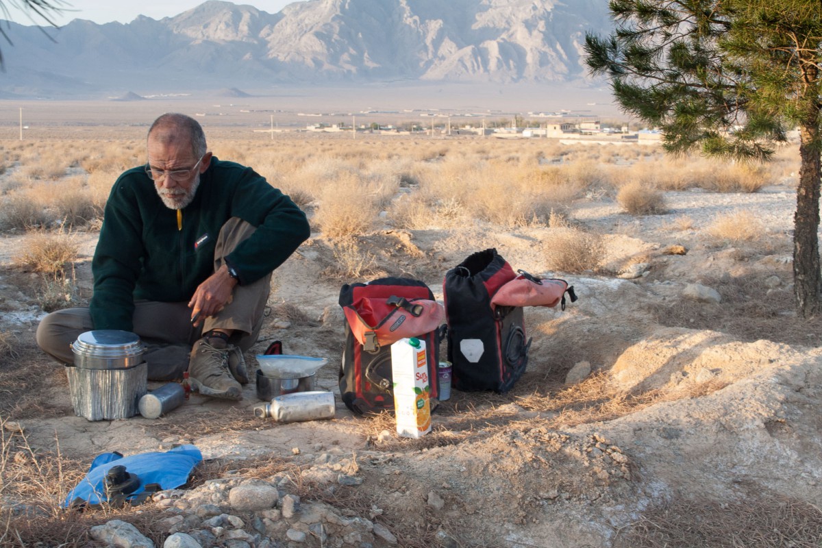 Cooking a spaghetti and veggies meal while free camping along the Yazd to Shiraz road